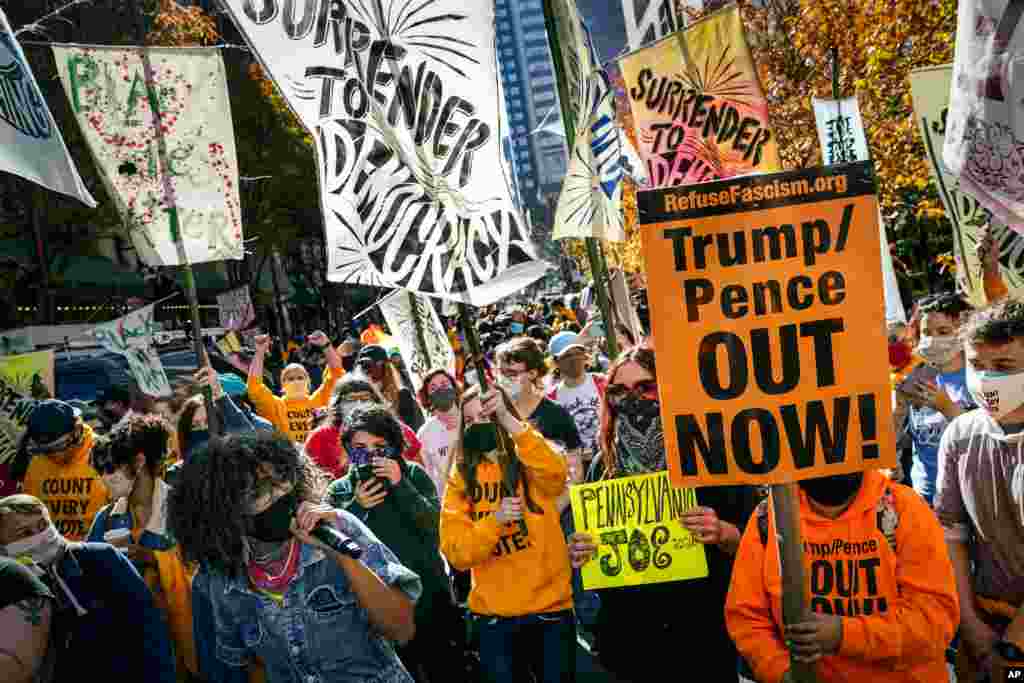 People urge for all votes to be counted as they demonstrate in Philadelphia, Pensylvania, Nov. 6, 2020.