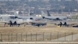 FILE - A Turkish Air Force F-16 fighter jet ( C foreground) is seen between U.S. Air Force A-10 Thunderbolt II fighter jets at Incirlik airbase in the southern city of Adana, Turkey, Dec. 11, 2015. 
