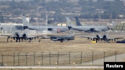 FILE - A Turkish Air Force F-16 fighter jet ( C foreground) is seen between U.S. Air Force A-10 Thunderbolt II fighter jets at Incirlik airbase in the southern city of Adana, Turkey, Dec. 11, 2015. 
