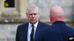 FILE - Britain's Prince Andrew attends the Sunday service at the Royal Chapel of All Saints at Royal Lodge, Windsor, in England, April 11, 2021. 