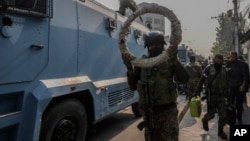 Indian paramilitary soldiers move toward the site of a gun battle in Srinagar, Indian-controlled Kashmir, on Nov. 2, 2024.