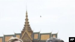 U.S. Secretary of State Hillary Rodham Clinton, left, and the U.S. Ambassador to Cambodia Carol Rodley stand in front of the Royal Palace on Monday.