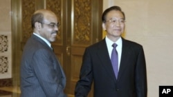 Chinese Premier Wen Jiabao, right, meets Ethiopian Prime Minister Meles Zenawi, at the Great Hall of the People in Beijing, China, August 15, 2011