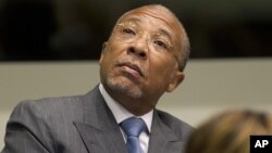 Former Liberian President Charles Taylor looks up to the public gallery as he waits for the start of his sentencing hearing in Leidschendam, near The Hague, Netherlands, May 16, 2012