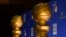 FILE - Golden Globe statues appear on stage prior to the nominations for 75th Annual Golden Globe Awards at the Beverly Hilton hotel in Beverly Hills, Calif., Dec. 11, 2017. 