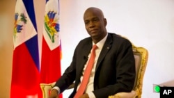 FILE - Haiti's President Jovenel Moise pauses during an interview in his office in Port-au-Prince, Haiti, Aug. 28, 2019. 