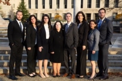 The seven children and wife of Robert Levinson, an American missing in Iran since 2007, appear outside U.S. District Court in Washington, Dec. 4, 2019, as they sue Iran for damages for his disappearance.