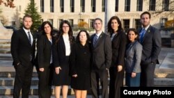 The seven children and wife of Robert Levinson, an American missing in Iran since 2007, appear outside U.S. District Court in Washington, Dec. 4, 2019, as they sue Iran for damages for his disappearance. 
