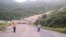 Locals inspect a landslide and damage to a road located near the township of Tabubil after an earthquake that struck Papua New Guinea's Southern Highlands, February 26, 2018. This image was supplied by a 3rd party.