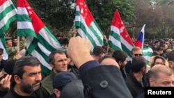 Protesters rally outside the parliament building in Sukhumi, the capital of Georgia's breakaway region of Abkhazia, Nov. 15, 2024. (DNA News Abkhazia/Handout via Reuters)