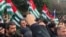 Protesters rally outside the parliament building in Sukhumi, the capital of Georgia's breakaway region of Abkhazia, Nov. 15, 2024. (DNA News Abkhazia/Handout via Reuters)