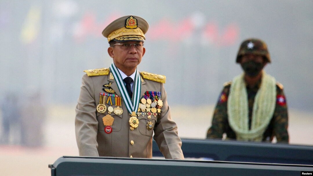 FILE - Myanmar's junta chief Senior General Min Aung Hlaing presides over an army parade on Armed Forces Day in Naypyitaw, March 27, 2021. 