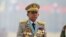 FILE - Myanmar's junta chief Senior General Min Aung Hlaing presides over an army parade on Armed Forces Day in Naypyitaw, Myanmar, March 27, 2021. 