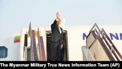 Myanmar's military leader Senior Gen. Min Aung Hlaing waves as he departs from Naypyidaw international airport, Myanmar to Russia, March 3, 2025. 