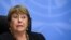 (FILES) In this file photograph taken on December 9, 2020, UN High Commissioner for Human Rights Michelle Bachelet looks on as she attends a press conference in Geneva. - The UN rights chief warned April 13, 2021, of possible crimes against humanity in My