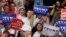 People cheer as Republican presidential nominee Donald Trump speaks on a stage during a campaign event in Dimondale, Mich., Aug. 19, 2016.