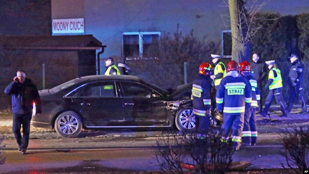 Police and fire brigade officers inspect Polish Prime Minister's Beata Szydlo's car after an accident in Oswiecim, Poland, Feb. 10, 2017. 