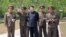 김정은 북한 국무위원장(당시 노동당 제1비서)이 인민군 405군부대를 시찰하고 있는 장면을 2013년 5월 조선중앙통신이 공개했다. 김정은 위원장 오른쪽 옆으로 림광일이 서 있다.