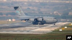 FILE - A United States Air Force cargo plane maneuvers on the runway after it landed at the Incirlik Air Base, on the outskirts of the city of Adana, southern Turkey, July 31, 2015. Pentagon orders to relocate 670 military dependents from Incirlik Air Base, Ismir, and Mugla, March 29, 2016, due to safety concerns.