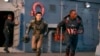 This image released by Disney shows Danny Ramirez, left, and Anthony Mackie in a scene from Marvel Studios' "Captain America: Brave New World." 