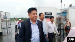 Members of the Myanmar delegation team arrive at the airport in Cox's Bazar, southern Bangladesh, July 27, 2019, ahead of meetings with Rohingya leaders to inform them of measures they have taken for their return to Rakhine state.