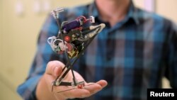 Researchers at the University of California, Berkeley, dubbed this robot Salto for its vertical jumping agility. Shown in a Nov. 17, 2016, photo, Salto features a motorized, spring-loaded leg mechanism that lets the robot to crouch and leap.