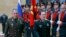 Russian Defense Minister Sergei Shoigu, left, and China's Defense Minister Wei Fenghe review an honor guard prior to their talks in Moscow, Russia, April 3, 2018.