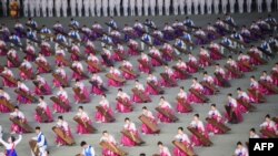 A photo taken on June 4, 2019 shows musicians during a 'Grand Mass Gymnastics and Artistic Performance', or mass games, at the May Day stadium in Pyongyang. 