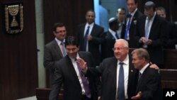 Israel's parliament has chosen Reuven Rivlin, second from right, a stalwart in the ruling Likud Party, as the country's next president, in Jerusalem, June, 10, 2014. 