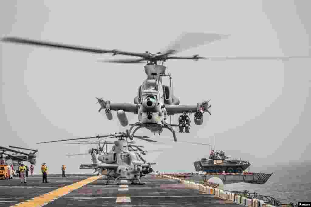 An AH-1Z Viper from Marine Medium Tiltrotor Squadron 163 (Reinforced), 11th Marine Expeditionary Unit (MEU) prepares for take-off aboard the amphibious assault ship USS Boxer (LHD 4) as it transits the Strait of Hormuz, off Oman, in this U.S. Navy photo.