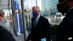 European Commission's Head of Task Force for Relations with the United Kingdom Michel Barnier talks to journalists as he leaves the EC headquarters in Brussels, Nov. 4, 2020.