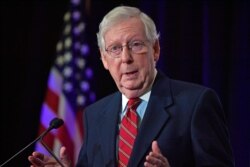 FILE - Senate Majority Leader Mitch McConnell, R-Ky., responds to a reporter's question during a press conference in Louisville, Ky., Nov. 4, 2020.