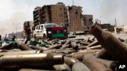 FILE: Bullet casings litter a street in the city of Misrata, Libya. Taken April 23, 2011. UN Rights Chief Volker Turk is calling for full accountability by all parties for war crimes in that war-torn nation. 