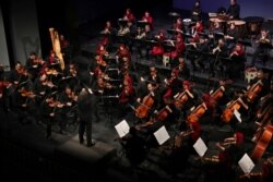 The Tehran Symphony Orchestra performs pieces by 19th-century Russian composers in Unity Hall, in Tehran, Iran, July 3, 2019.