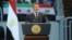 In this handout picture Egyptian President Mohammed Morsi gives a speech to thousands of Islamists and Syrian opposition supporters during the "support for Syria" rally at Cairo stadium, June 15, 2013 in Cairo, Egypt. (Credit: Ho/Egyptian Presidency)