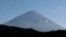 Peak of Mount Fuji showing snow as seen from Fujikawaguchiko, Yamanashi Prefecture, Japan. November 7, 2024. (Tom Bateman/REUTERS)
