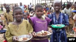 Children receiving food from the United Nations World Food Program.