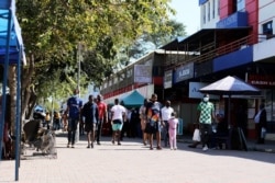 People going about their activities in Gaborone, Botswana, before authorities announced the city's return to lockdown on June 12, 2020. (Mqondisi Dube/VOA)