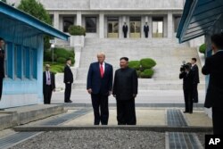 President Donald Trump and North Korean leader Kim Jong Un stand on the North Korean side in the Demilitarized Zone, June 30, 2019 at Panmunjom. (AP)