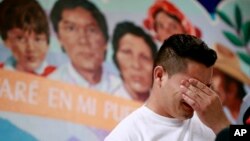 FILE - Christian, from Honduras, recounts his separation from his child at the border during a news conference at the Annunciation House,in El Paso, Texas, June 25, 2018. 