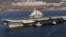 Chinese aircraft carrier Liaoning cruises back to a port after its first navy sea trial in Dalian, in northeastern China's Liaoning province, October 30, 2012.