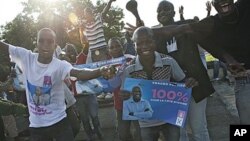 Supporters of Laurent Gbagbo celebrate in the streets of Adjame neighborhood, in Abidjan, Ivory Coast, after the constitutional council declared incumbent Gbagbo the winner a day after the election chief handed victory to the opposition, Dec 3, 2010