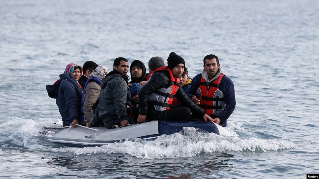 Migrants from Afghanistan on a dinghy approach a beach near the village of Skala Sikamias on the island of Lesbos, Greece, February 28, 2020. REUTERS/Costas Baltas