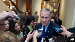 Democratic Governors Association (DGA) Vice Chairman Gov. Jay Inslee of Washington state, speaks with reporters after leaving a health care reform meeting during the National Governors Association Winter Meeting in Washington, Feb. 25, 2017.