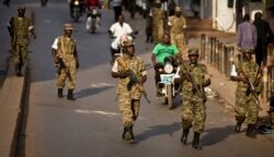 FILE - Ugandan army soldiers deploy, after the election result was announced, in downtown Kampala, Uganda, Feb. 20, 2016.