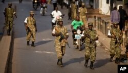 FILE - Ugandan army soldiers deploy, after the election result was announced, in downtown Kampala, Uganda, Feb. 20, 2016.
