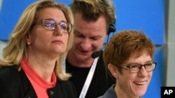 Christian Democratic top candidate Saarland governor Annegret Kramp-Karrenbauer, right, and the top candidate of the Social Democratic party Anke Rehlinger attend a TV debate after the state election in German state of Saarland in Saarbruecken, March 26, 