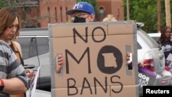 FILE - Protesters gather on the lot of Planned Parenthood in St. Louis, June 24, 2022. 