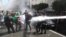 Algerian security forces use a water canon to disperse students taking part in an anti-government demonstration in the capital Algiers.