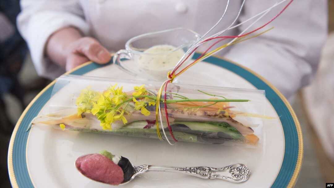 White House Executive Chef Cris Comerford shows the first course for the Japanese State Dinner, a Toro Tartare and Caesar Sashimi Salad, in the State Dining Room of the White House in Washington, DC, on the eve of the State Dinner, April 27, 2015. 